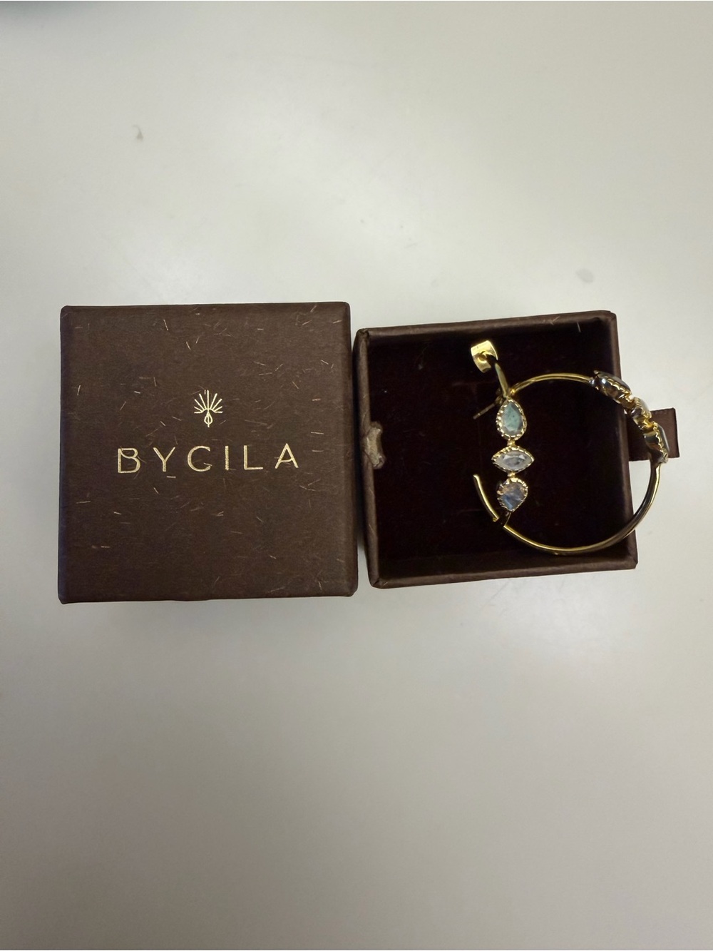 ByCila Gold plated 1” hoops with light blue and gray stones
